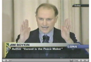 TV still of John Boykin giving a speech